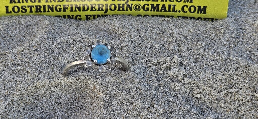 Find a lost ring in the sand with a metal detector service